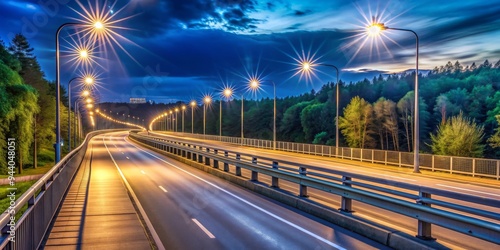 Nighttime Highway Through the Forest Long Exposure with Starburst Lights photo