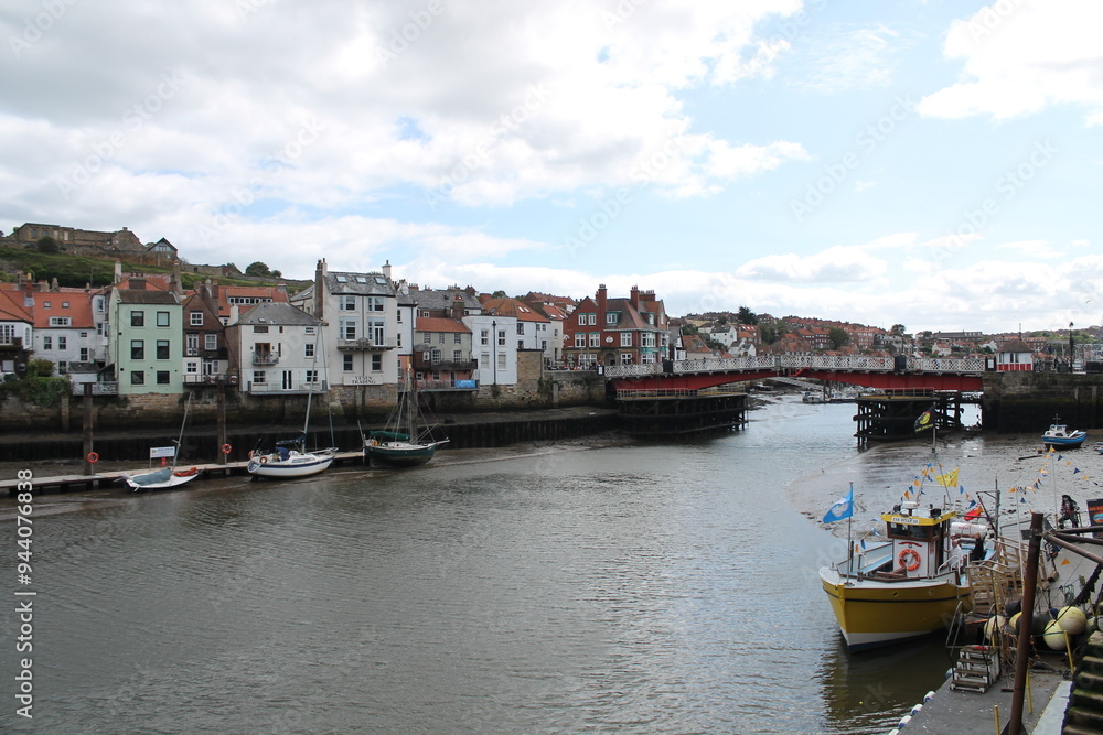 Whitby North Yorkshire UK 21st August 21 2024 Whitby a British seaside town with boats moored in the harbour on a hot summers Whitby North Yorkshire UK 21st August 21 2024 Whitby a British seaside town with boats moored in the harbour on a hot summers
