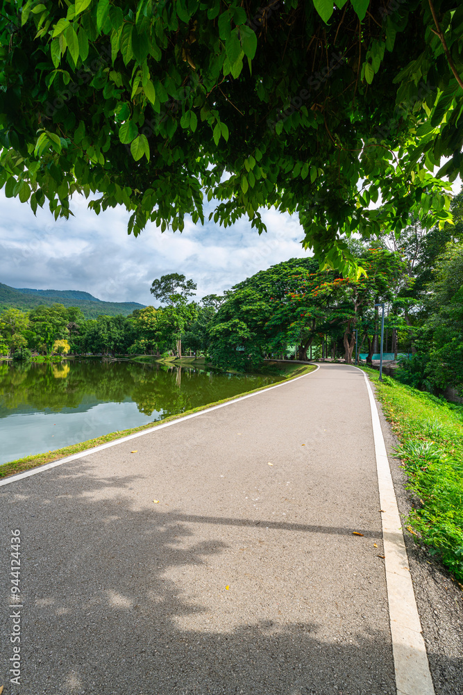 a public place leisure travel landscape lake views at Ang Kaew Chiang Mai University and Doi Suthep nature forest Mountain views spring cloudy sky background with white cloud. a public place leisure travel landscape lake views at Ang Kaew Chiang Mai University and Doi Suthep nature forest Mountain views spring cloudy sky background with white cloud.