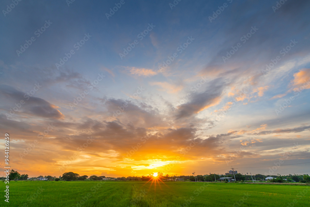 Twilight blue bright and orange yellow dramatic sunset sky in countryside or beach colorful cloudscape texture with white clouds air background. Twilight blue bright and orange yellow dramatic sunset sky in countryside or beach colorful cloudscape texture with white clouds air background.