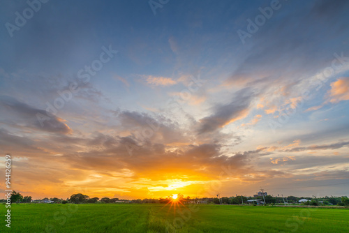 Twilight blue bright and orange yellow dramatic sunset sky in countryside or beach colorful cloudscape texture with white clouds air background.