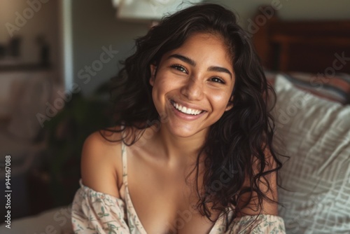 Free Download Smiling portrait of a young Hispanic woman at home - GFXLoad