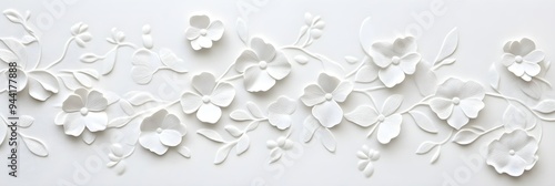 a white paper background adorned with delicately embossed flowers, a textured floral pattern that combines elegance with simplicity