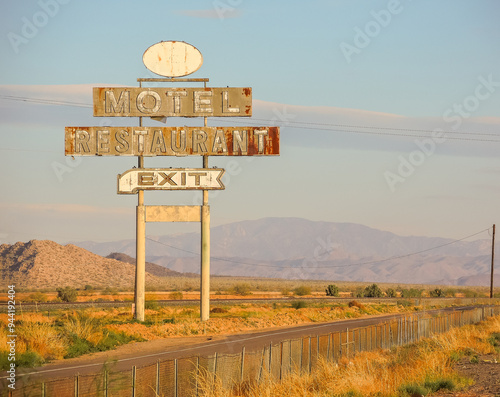 Abandoned motel restaurant exit highway neon billboard sign photo