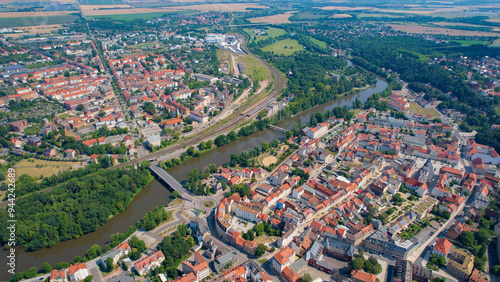 A wide angle aerial view of the old town of the city Weissenfels on a summer noon in Germany.