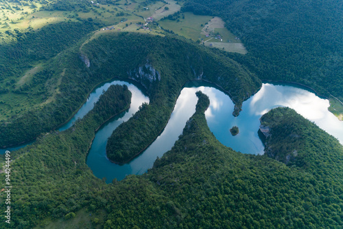 aerial view of a picturesque river meandering among the hills photo