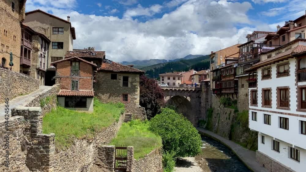 Spain Potes pan across river town Picos de Europa Cantabria Spain Potes pan across river town Picos de Europa Cantabria