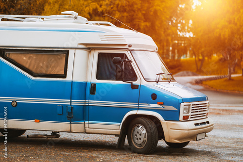 Blue motorhome parked outdoors in nature photo