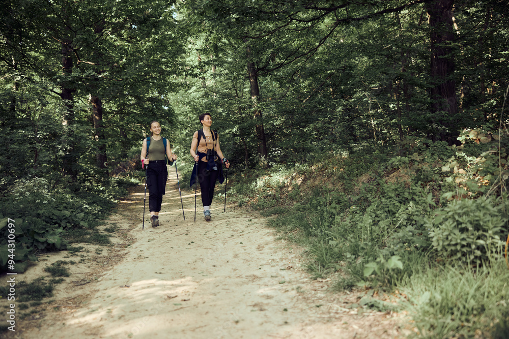 Mother And Daughter Hiking In The Forest Mother And Daughter Hiking In The Forest