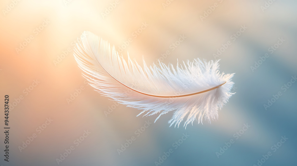 Naklejka premium A feather floating mid-air with delicate light beams emanating from it, symbolizing lightness and creativity of thought, captured in soft focus against a plain, blurred background.