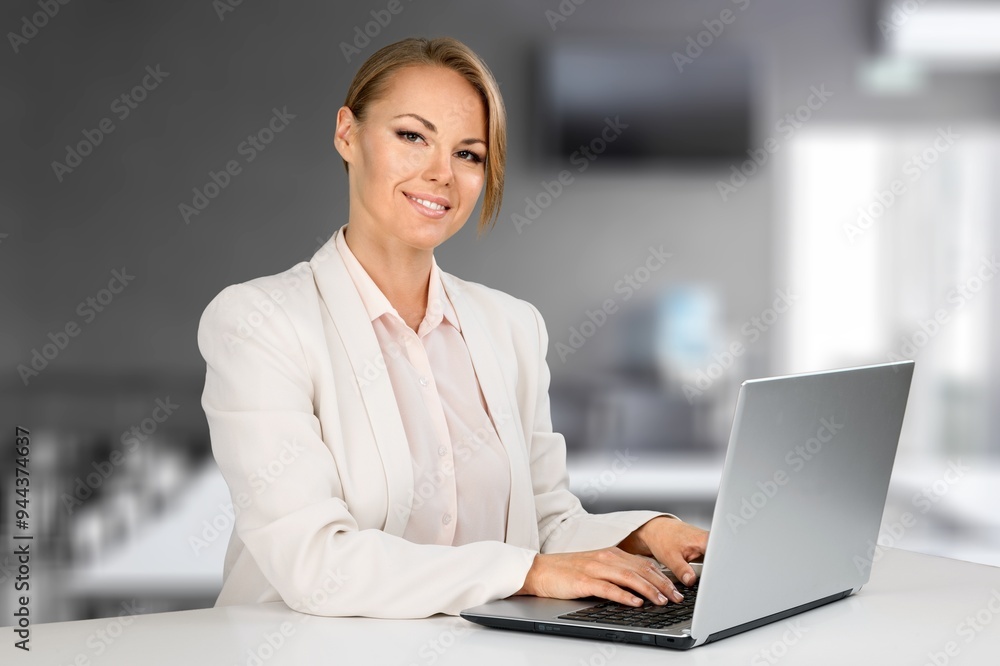 Woman working online, checking emails in an office Woman working online, checking emails in an office