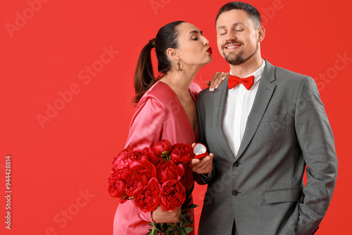 Young man proposing to his ...