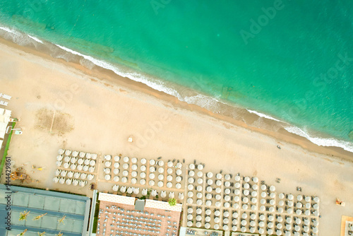 Fototapeta Naklejka Na Ścianę i Meble -  Top view of the beach with umbrellas and sunbeds