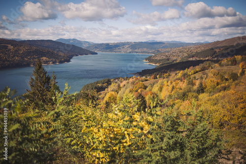 mountain view in autumn overlooking lake. Beautiful autumn colours near the bicaz lake,romania photo