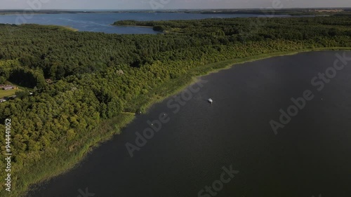 Fly over the a green and scenic nature area called Jabelscher See which is located at the Mecklenburg Vorpommern Lake area as the known former East Germany region photo