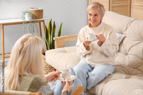 Mature woman drinking tea w...
