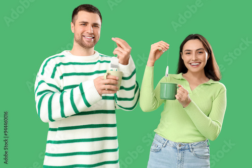 Young couple dipping tea ba...