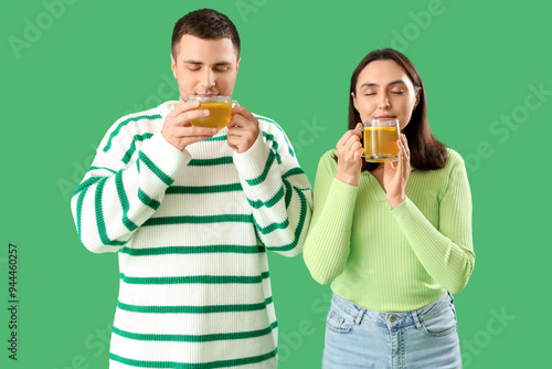 Young couple with glass cup...