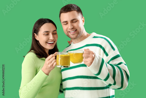 Young couple with glass cup...