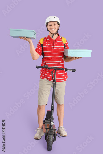 Male courier with boxes and...