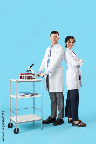 Young chemists with table o...