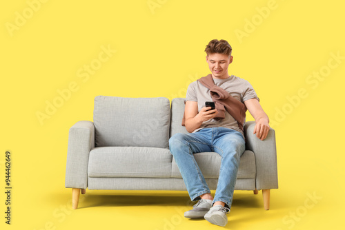 Young man using mobile phon...