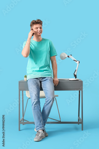 Young man talking by mobile...
