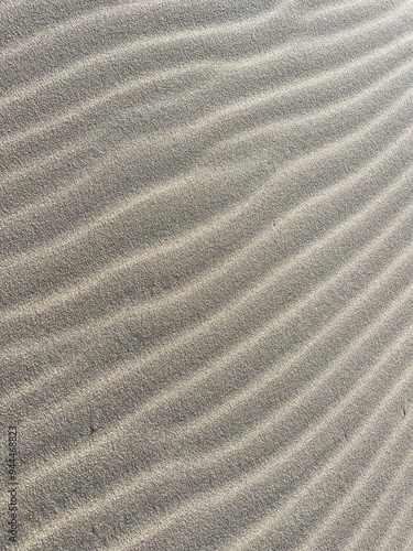 Beach sand wave pattern created by wind and waves