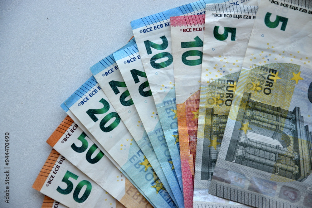 Many european euro money bills in chaotic arrangement. Pile of eur banknotes with different colors and condition Many european euro money bills in chaotic arrangement. Pile of eur banknotes with different colors and condition