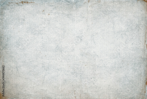 Vintage paper texture. Old worn damaged shabby parchment. Grunge grey background