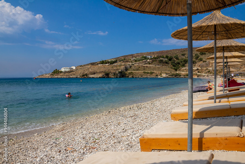 Fotografía Borsh,Albania, July 10,2024: rocky coastline with a blue sky full of summer colo