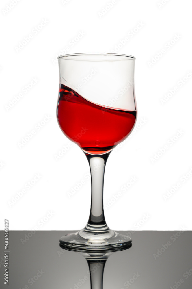 Red wine in glass in front of white background Red wine in glass in front of white background