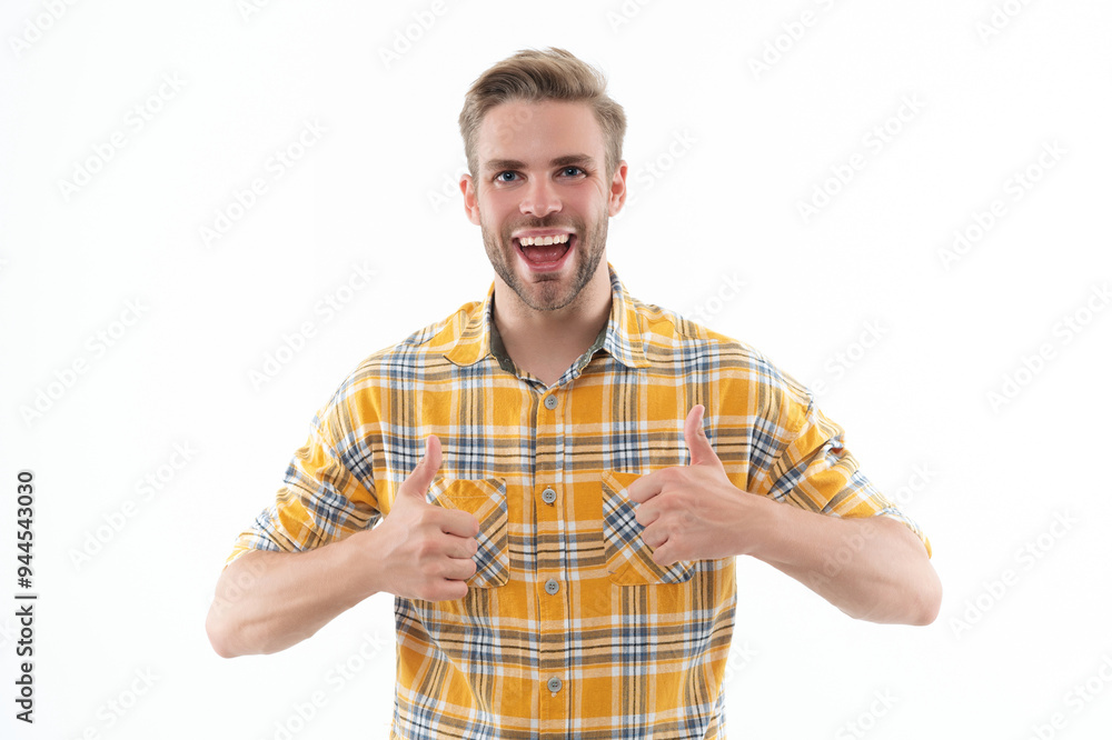 Stylish man with stylish hairstyle. Trendy male fashion style. Male casual style. Face portrait. Caucasian casual guy. Man in checkered shirt isolated on white. Thumb up Stylish man with stylish hairstyle. Trendy male fashion style. Male casual style. Face portrait. Caucasian casual guy. Man in checkered shirt isolated on white. Thumb up