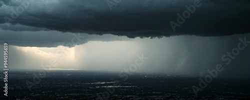 Dark Blue Sky during a Thunderstorm over a Night Landscape
