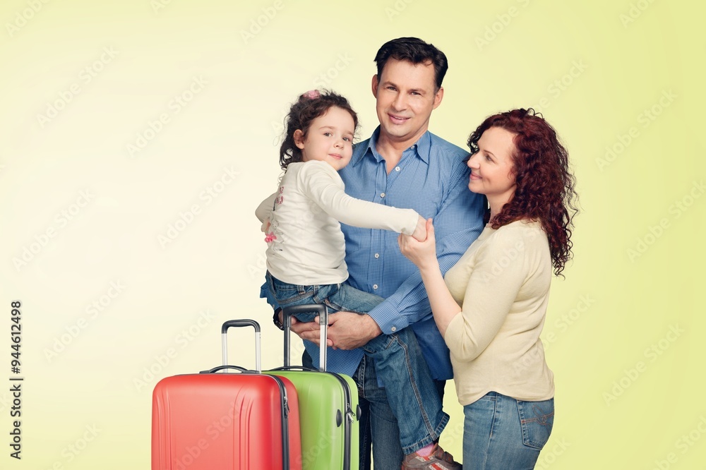 Traveler parents with small child posing with suitcase Traveler parents with small child posing with suitcase