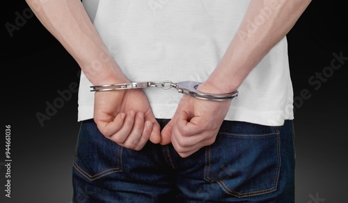 Businessman person hands in handcuffs arrested