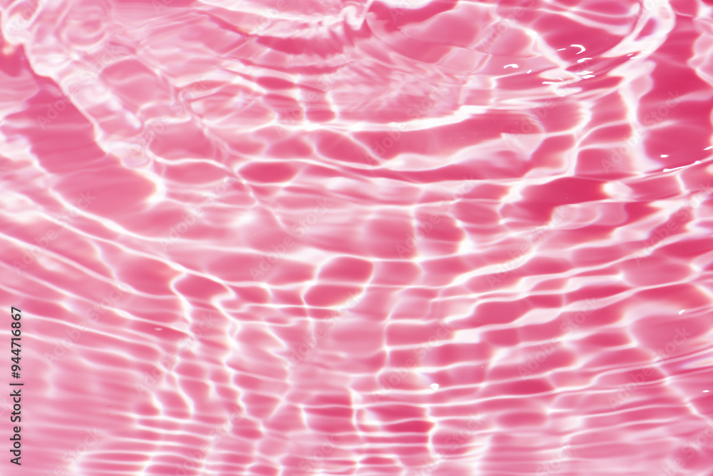 Pink water bubbles on the surface ripples. Defocus blurred transparent pink colored clear calm water surface texture with splash and bubbles. Water waves with shining pattern texture background Pink water bubbles on the surface ripples. Defocus blurred transparent pink colored clear calm water surface texture with splash and bubbles. Water waves with shining pattern texture background