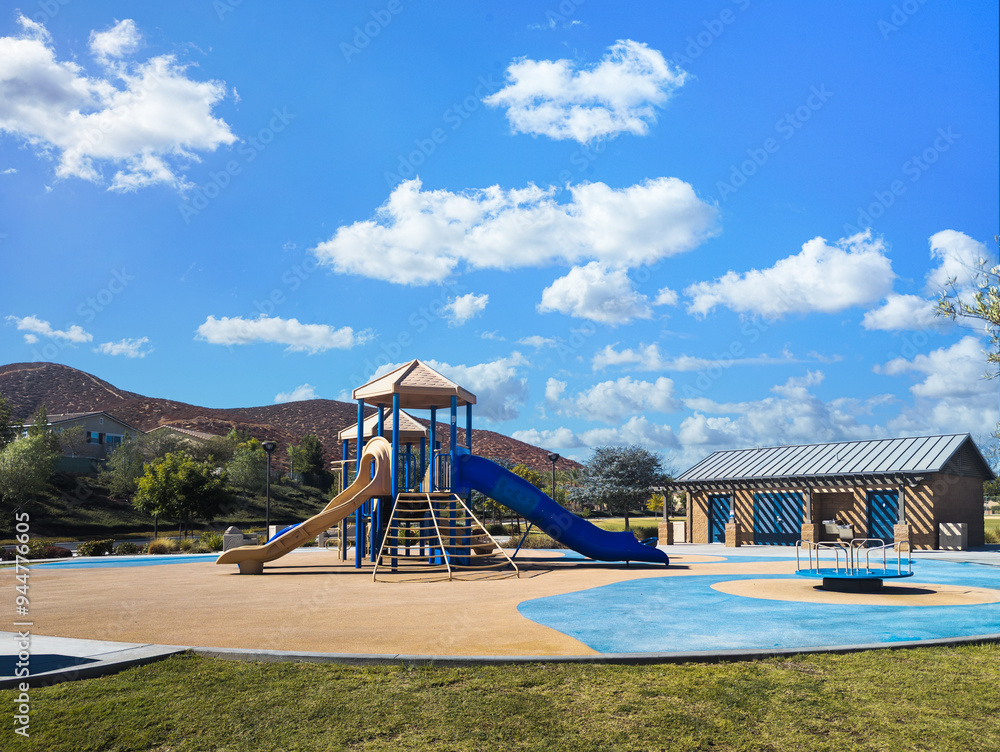 Fototapeta premium Outdoor playground equipment with slides at a public park