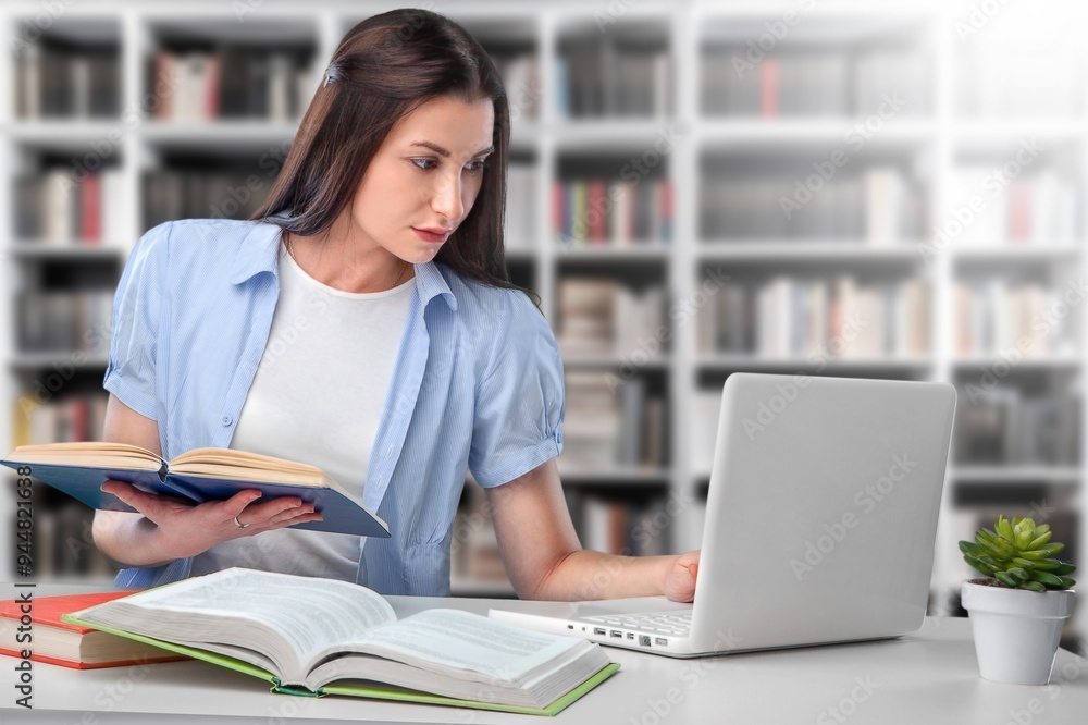 Happy college or school student at a library interior Happy college or school student at a library interior
