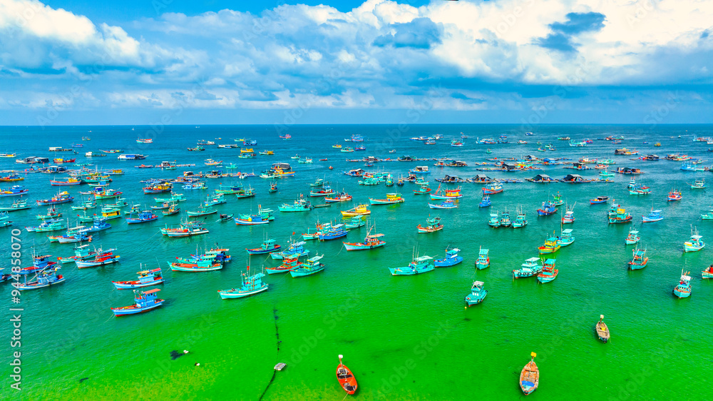 Aerial view of wooden fishing boat on sea and An Thoi town in Phu Quoc Island, Vietnam. Aerial view of wooden fishing boat on sea and An Thoi town in Phu Quoc Island, Vietnam.