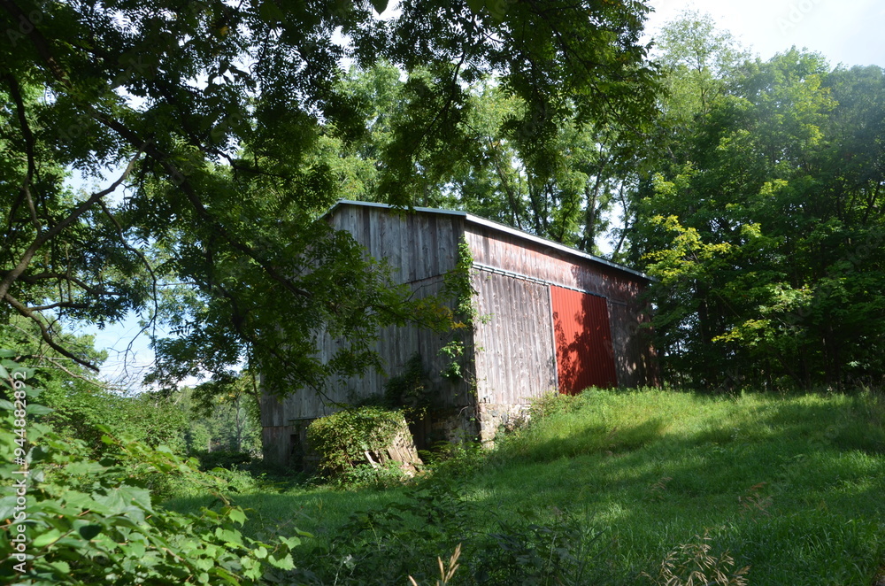 old red barn in the countryside old red barn in the countryside