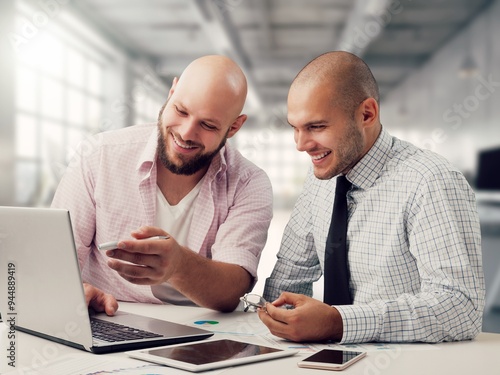 Two happy professional business people team working