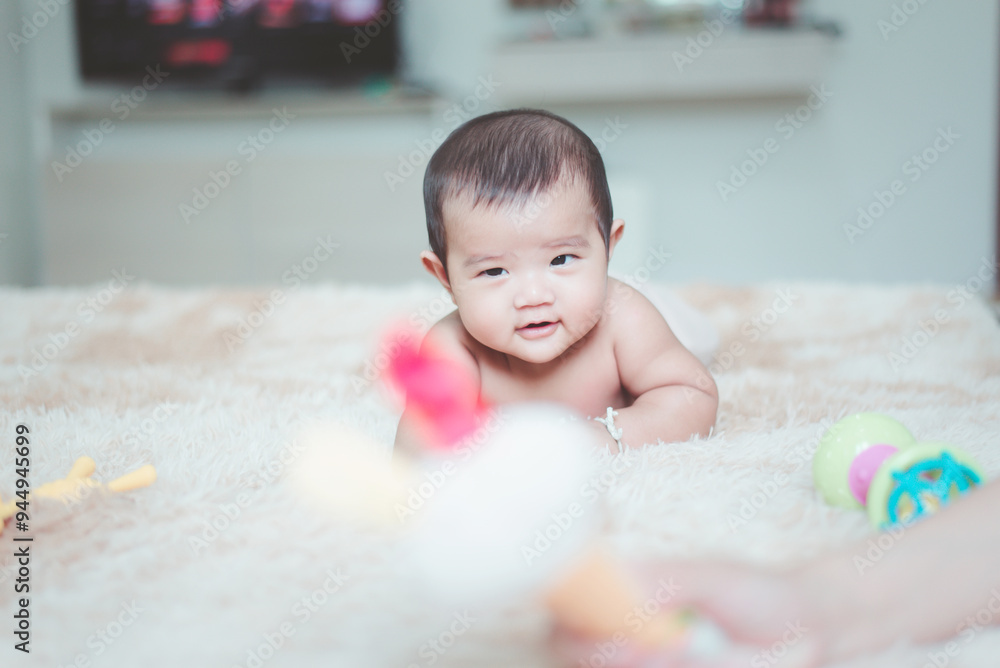 Happy adorable asian baby boy relaxing on bed,Newborn child,Tummy Time Happy adorable asian baby boy relaxing on bed,Newborn child,Tummy Time