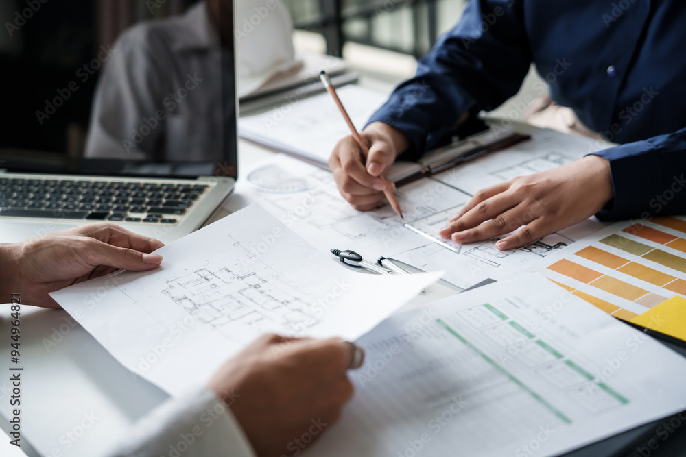 Engineer or interior Architects designer construction plans on blueprint Engineer or interior Architects designer construction plans on blueprint