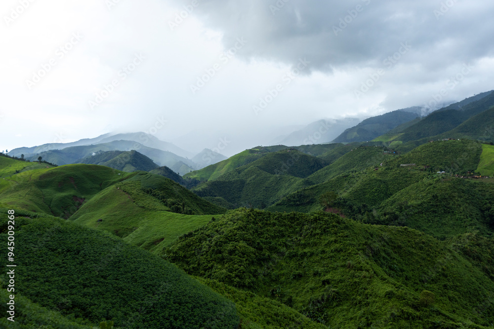 Landscape of Morning Mist with Mountain Layer at north of Thailand. mountain ridge and clouds in rural jungle bush forest Landscape of Morning Mist with Mountain Layer at north of Thailand. mountain ridge and clouds in rural jungle bush forest