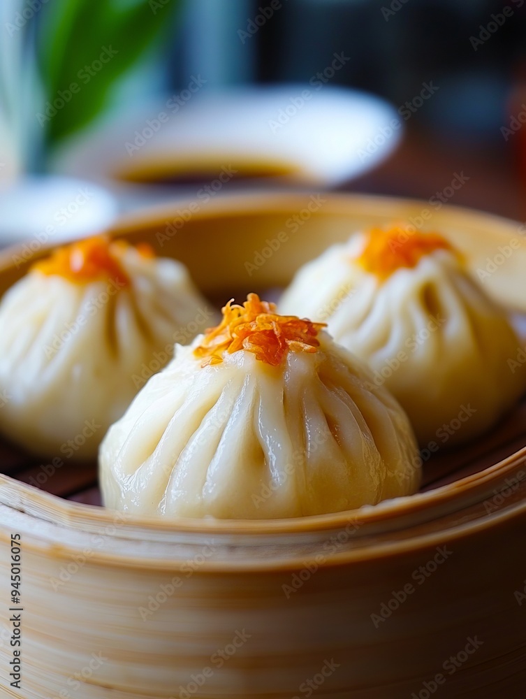 Three dim sum dumplings in a bamboo steamer on a table Three dim sum dumplings in a bamboo steamer on a table