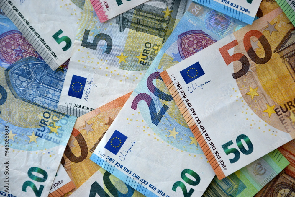 Many european euro money bills in chaotic arrangement. Pile of eur banknotes with different colors and condition Many european euro money bills in chaotic arrangement. Pile of eur banknotes with different colors and condition