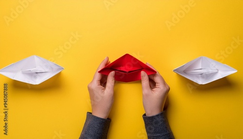 Hand holding a paper boat with a prominent business concept. generative ai