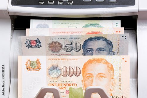 Singapore dollar in the counting machine photo