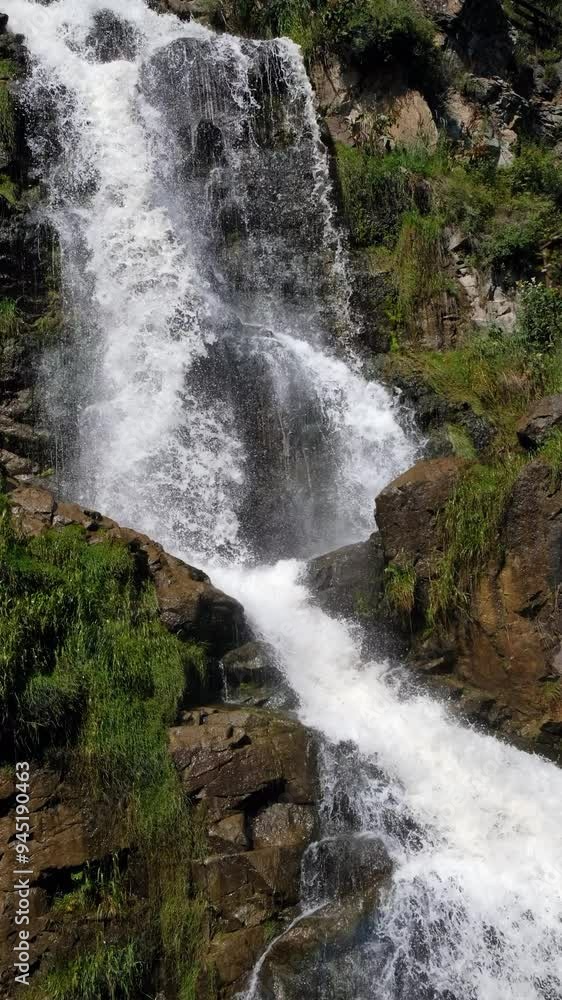 Vertical video of Kamyshlinsky Waterfall. Waterfall located at the mouth of the river Kamyshla in Shebalinsky District of the Republic Gorny Altai. Vertical video of Kamyshlinsky Waterfall. Waterfall located at the mouth of the river Kamyshla in Shebalinsky District of the Republic Gorny Altai.